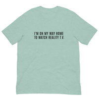 Unisex t-shirt feels soft and lightweight, with the right amount of stretch "I'M ON MY WAY HOME TO WATCH REALITY T.V."