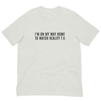 Unisex t-shirt feels soft and lightweight, with the right amount of stretch "I'M ON MY WAY HOME TO WATCH REALITY T.V."