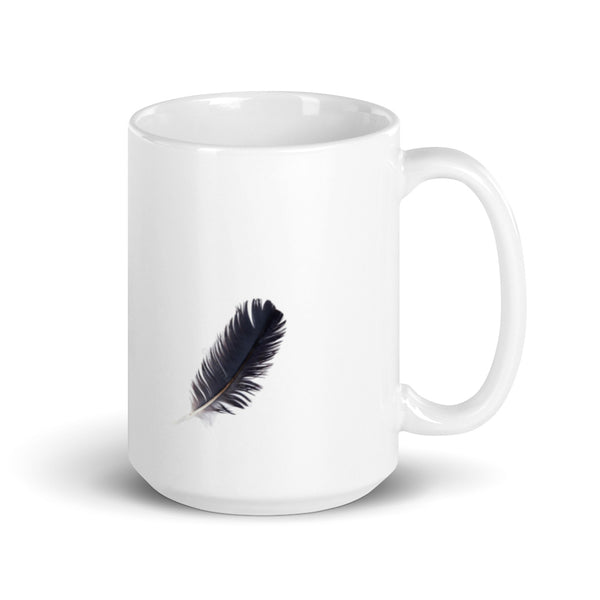 White glossy mug with black crow feather